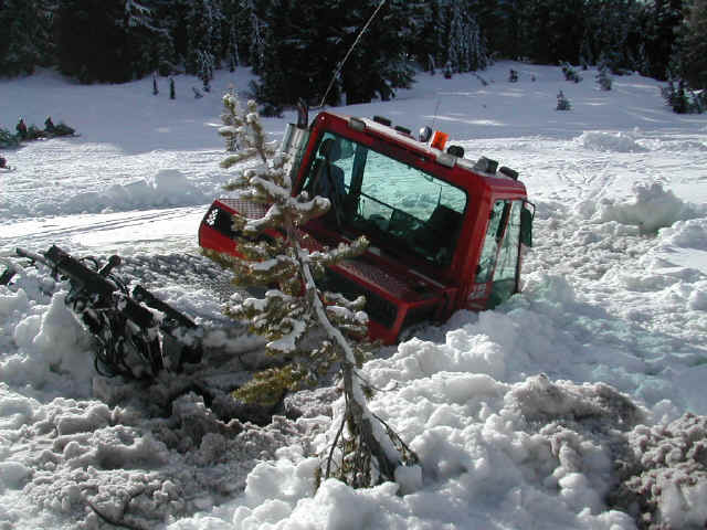 Groomer stuck in the melted snow in February 2003