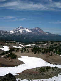 Looking across Golden Lake at Middle and North Sister in mid July