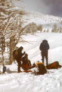 Dropping the snowshoes, putting on crampons